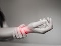 Black and white woman holds her wrist hand injury Royalty Free Stock Photo