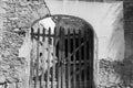 Black and white wooden gate in an archway Royalty Free Stock Photo