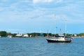 Black and white yacht, small yacht on the water in the city