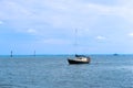 Black and white yacht on the water, yacht with lowered sails