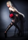 Black widow in grief with flowers with a veil Royalty Free Stock Photo