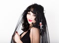 Black widow in a veil, mysterious sad woman wearing lace Royalty Free Stock Photo