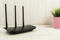 Black WiFi router in living room. Royalty Free Stock Photo