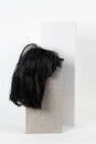 Black wig cinder block Royalty Free Stock Photo