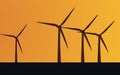 Black wind turbines on orange background