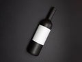 Black wine bottle on a black background. Mock-up. Copy space Royalty Free Stock Photo