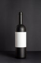 Black wine bottle on a black background. Mock-up. Copy space Royalty Free Stock Photo