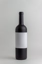 Black wine bottle on a white background. Mock-up. Copy space Royalty Free Stock Photo