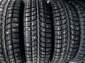 Winter wheel tyres. Black winter studded tires in store