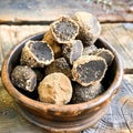 Black winter truffles and truffle cross section. The most famous of the truffles Royalty Free Stock Photo