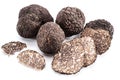 Black winter truffles and truffle slices on white background. The most famous of the trufflez Royalty Free Stock Photo