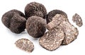 Black winter truffles and truffle slices on white background. The most famous of the trufflez Royalty Free Stock Photo