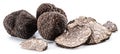 Black winter truffles and truffle slices on white background. The most famous of the trufflez Royalty Free Stock Photo