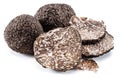 Black winter truffles and truffle slices on white background. The most famous of the trufflez Royalty Free Stock Photo