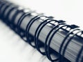 Black wire ring binding on a notebook Royalty Free Stock Photo