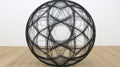Black wire sphere art gallery floor display Royalty Free Stock Photo