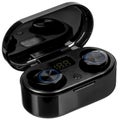 Black wireless bluetooth headphones and charging box Royalty Free Stock Photo