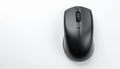 Black Wireless Computer Mouse Resting on a White Surface with Copy Space wireless mouse Royalty Free Stock Photo