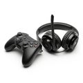 Black wireless gaming controller and headset on a white background Royalty Free Stock Photo