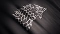 Black wolf grin silhouette on fluttering abstract flag of grey color, seamless loop. Monochrome direwolf as an emblem of