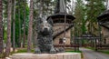 A black wolf statue in front of the entrance gate to the park called Seagull in the Clouds