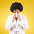 Black woman, afro and sick blowing nose with tissue and morning gown against a studio background. Isolated African Royalty Free Stock Photo