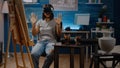 Black woman with artistic vision using vr glasses for drawing inspiration