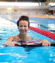 Black woman attending water aerobics class in a swimming pool Royalty Free Stock Photo