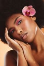 Black woman, beauty and face, flower and makeup with natural cosmetology advertising closeup. African American model Royalty Free Stock Photo