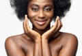 Black Woman Beauty Face. Happy Afro American Model Portrait with Curly Natural Hair and Shiny Full Lips over White Studio Royalty Free Stock Photo