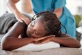 Black woman, bed and relax in spa for back massage, deep tissue or relaxation in stress relief at resort. Happy African