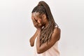 Black woman with braids standing over isolated background with sad expression covering face with hands while crying Royalty Free Stock Photo