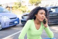 Black woman calling roadside service insurance support after car crash Royalty Free Stock Photo