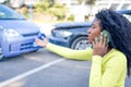 Black woman calling roadside service insurance support after car crash Royalty Free Stock Photo