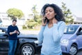 Black woman calling roadside service insurance support after car crash Royalty Free Stock Photo