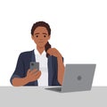 Black Woman chatting on a smartphone sitting at the desk. Happy freelancer or office female working remotely use a laptop