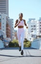 Black woman, city running and cardio fitness training, workout and exercise in urban city outdoors. Focus, motivation