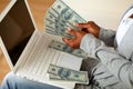 Black woman counting plenty of cash money