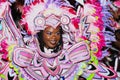 A black woman dancer in pink and white costume