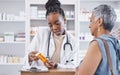 Black woman, doctor and prescription medication for patient or over the counter pills at pharmacy. African medical Royalty Free Stock Photo