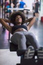 Black woman doing sit ups at the gym Royalty Free Stock Photo