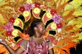 A black woman dressed in a colorful costume at Junkanoo