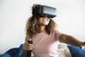 Black woman experiencing virtual reality with VR headset