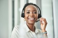 Black woman face, call center and phone consultation with a smile in a office with contact us work. Telemarketing Royalty Free Stock Photo