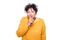 Black woman with finger on lips asking for silence and shut up Royalty Free Stock Photo