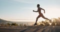 Black woman, fitness and running on mountain during sunset for workout, training or exercise in the nature outdoors Royalty Free Stock Photo