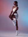 Black woman fitness, stretching in studio with sportswear or sports fashion in fitness exercise for knee and legs. Girl Royalty Free Stock Photo