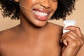 Black woman flossing teeth with bright smile, close-up Royalty Free Stock Photo