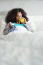 Black Woman With Flu And Cold Holding Ice Bag