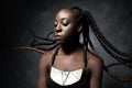 Black woman with the flying braided long hair Royalty Free Stock Photo